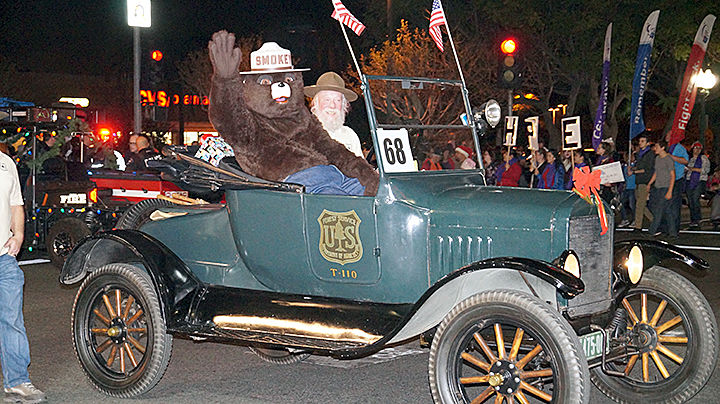 Smokey Bear waves to the crowd at the 2018 Redlands Christmas Parade. Smokey waves to the crowd.